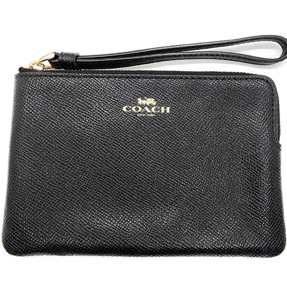 Brand new leather Coach wristlet.